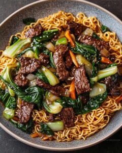 Crispy Beef Stir-Fry with Bok Choy over Pan-Fried Noodles Recipe