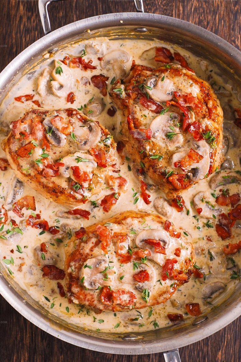 Smothered Pork Chops with Bacon, Mushrooms, and Fresh Thyme Cream Sauce Recipe