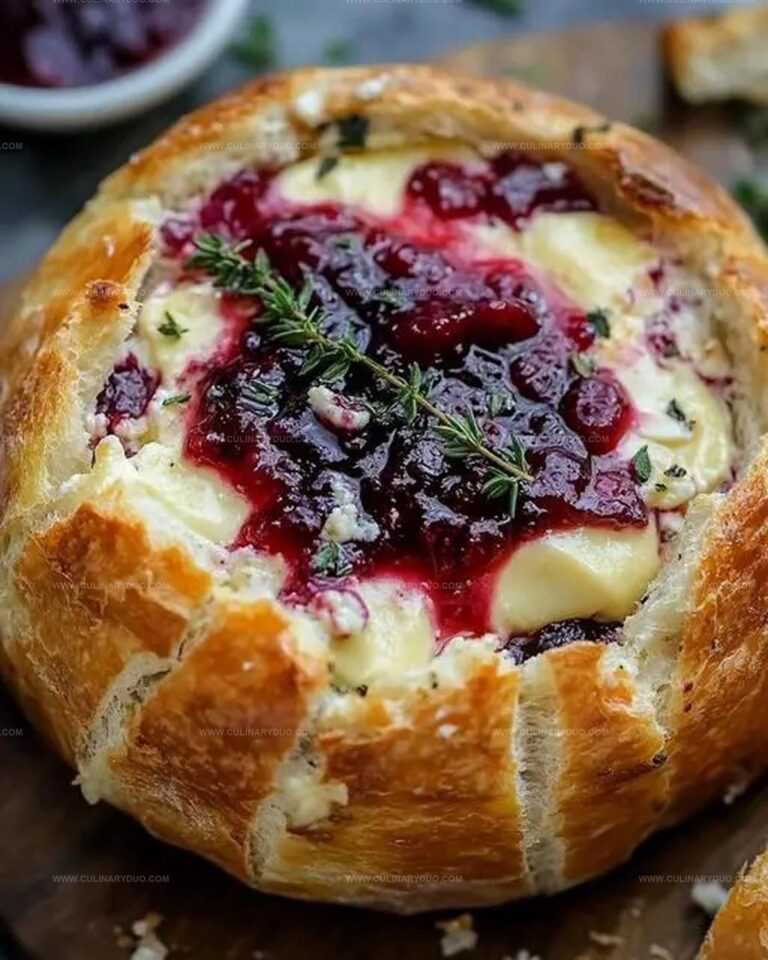 Baked Brie in Bread Bowl with Cranberry Sauce and Thyme Recipe